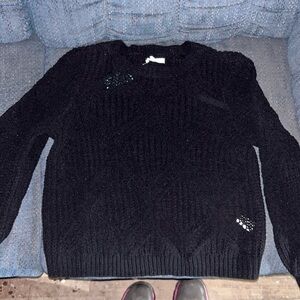 Black long sleeve sweater.